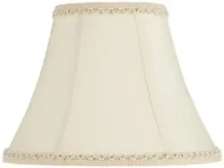 Softback round bell curve lamp shade. Rayon fabric. Cream solid color. The correct size harp and a finial are included...