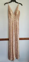 Soft satin feel inside w/a vertical pattern gold sequin on the outside. Only worn once!