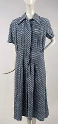 FASHIONED OF COTTON RAYON BLEND WITH A BLUE GROUND IN A WHITE BOW AND UNICORN NOVELTY PRINT. PLEATS TRIM THE FRONT....