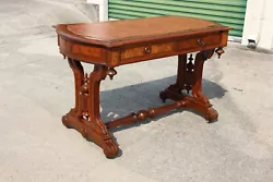 Beautiful burl accents adorn all sides of this beautiful turtle-shaped desk. Moreover, each side has one faux drawer...