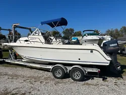 This is a nice, good running, ready to go 1998 Ket West 2300 Bluewater Walkaround boat with 2008 aluminum Venture...