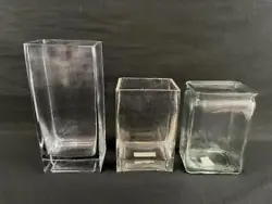 This is a lot of 3 rectangular glass flower vases. The vases are The vases are pre-owned and one has a small chip on...