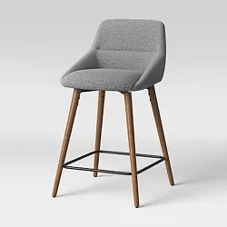 The comfy backrest and built-in footrest let you sit in comfort, a. With its mid-century modern design, this gray...