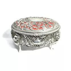 Main box has winged lion design, curved feet. Ornate molded filigree flower design over red flocking on lid. Made in...