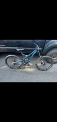 This downhill mountain bike is a high-performance machine built for the toughest terrain. It features a Devinci brand,...