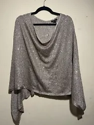 Size large women’s top. Open shawl, pullover closure. Party design with sequins for added shine to any outfit! In...
