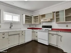 Sears roebuck catalog 1950s metal kitchen cabinets. White with red countertops included. Comes with sink and sink base...