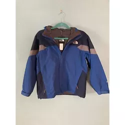 The North Face boys Approach raincoat jacket with attached hood size large with side zipper pockets, a zipper Velcro...