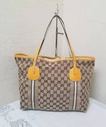 Materials: Canvas and patent leather trim and handle. No dust bag. Bottom and corners: small scuff on the corner and...