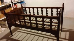 Slats pull up inside and crib can be folded. Casters on all 4 legs. Antique approx 1855 pre-Civil War wood baby bed...