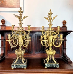 “An exceptional pair of 19th century Neoclassical six light candelabras in Adams Style, Each on the square Antico...