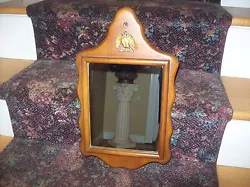 IT IS 18 X 10.5, GREAT QUALITY MIRROR SURROUNDED BY SOLID MAPLE WOOD. THIS IS A WELL MANUFACTURED MIRROR THAT IS IN...