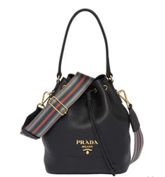 PRADA Daino Top-Handle Bucket Bag with Web Strap. Prada bucket bag in calfskin leather. Fixed top handle with rings....