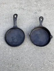 1 Cast Iron Double Pour Pan. 1 Short Sided Skillet. Unbranded. No cracks the skillet has a casting wave on the back...