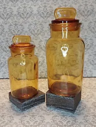 Up for sale is a Set Of 2 Vintage Apothecary Amber Glass Jars.  These are absolutely gorgeous and show amazing age on...