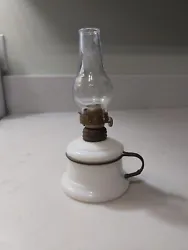 For sale, I have an antique white mini oil lamp. The oil lamp has no chips or cracks. The burner is in as pictured...