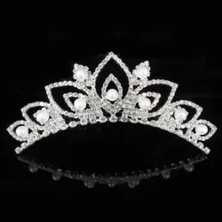 You will be receiving 1 beautiful small silver plated rhinestone comb in tiaras as shown in the picture. Great for...