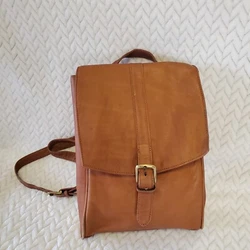 Boulder Ridge Shaftmaster Leather Co. Full Grain Cowhide bag. With just a pull of the strap it instantly turns into a...