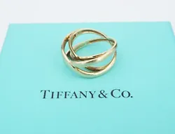 This lovely ring is a unique design featuring a double crossover infinity design, crafted of solid 18k yellow gold. A...