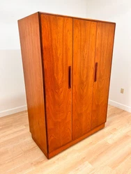 Made from teak and mounted on its original plinth.