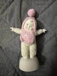 This Snowbabies figurine from the Department 56 collection captures a precious moment of a baby girl admiring herself...