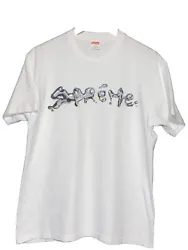 Supreme liquid tee size Medium. In good condition has a small dot stain below last E.