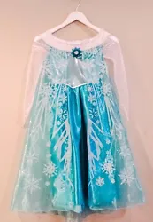 What Little Girl Doesnt Want An Elsa Dress?! Size: M 7-8 Fabric: Polyester Includes Tiara. This dress is perfect for a...