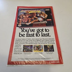 Step back in time to 1993 with this vintage Super Nintendo advertisement featuring the iconic Street Fighter II Turbo...