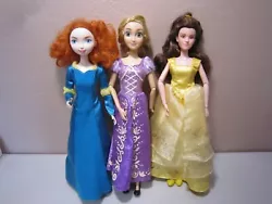 Rapunzel and Belle have articulated elbows and wrists. All are used dolls and have original dresses and shoes.