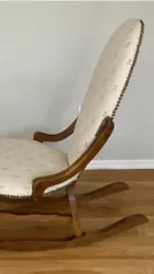 ANTIQUE UPHOLSTERED WITH NAIL HEADS, SLENDER, OVAL BACK DECO / VICTORIAN ROCKING CHAIR WITH NAIL HEADS.