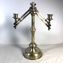 This adjustable brass candle holder has two arms that swing out (screws tighten any extended position), and has a heavy...