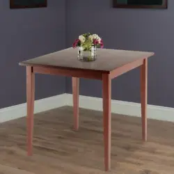 Sophisticated in its simplicity, the table has slightly tapered legs and is made of solid wood for long-lasting...