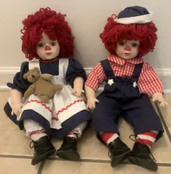 Raggedy Ann & Andy Porcelain Dolls 16”. Items are used with normal wear. No sailboat.