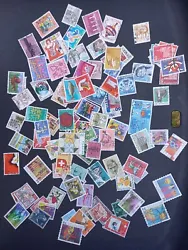 lot Environ 100 timbres Suisse oblitérés.