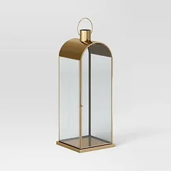 •Tall metal lantern •Gold-tone frame •Holds a pillar candle •Comes with a top handle •Suitable for tabletop...