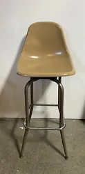 A set of 3 (three) Mid Century Eames style fiberglass shell seat swivel bar stools. Made in USA, circa...