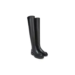 Captivating and utilitarian, this over the knee boot is luxe around the edges.  Faux leather upper partially made from...