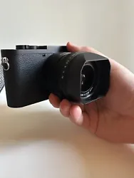 Like new Leica Q2 Monochrom. Included is an orange Leica lens filter, and additional slip on hood cap, a Leica thumb...