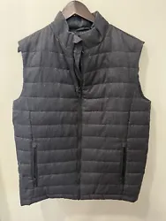 Elevate your style with this Mens Murano Gray Puffer Vest in size medium. The dark grey color, zip front and puffer...