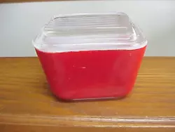 This is an old square Pyrex refrigerator dish. It looks like it never saw the inside of a dishwasher-color is nice and...