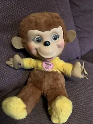 Vintage 1960s Hugging stuffed Monkey. Press his little heart and he squeaks and moves his arms in. There is a hole in...