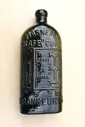 The heavily embossed, safe pictorial bottle is quite crudely made with imperfections in the glass on the rear.