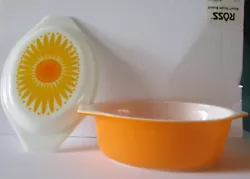 Available as pictured is a Pyrex 1.5 qt. This dish is sunflower yellow/orange with a daisy lid.