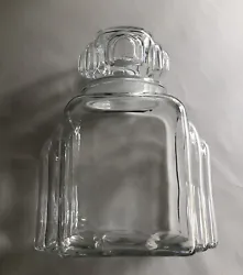 This listing is for a vintage glass jar with ground glass (tight fitting) top, from an estate collection. I believe it...
