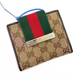 Gucci Compact Wallet Brown Beige GG Canvas Monogram Leather Web Stripe BifoldVery good overall preowned condition. 4