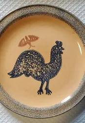 Pfaltzgraff USA Pottery. Rooster design. Yellow/gold Stoneware with blue and brown design. Holes on back for hanging.