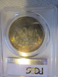 PCGS graded MS64. Slight orange rim toning on obverse. Toning covers nearly the entire reverse.