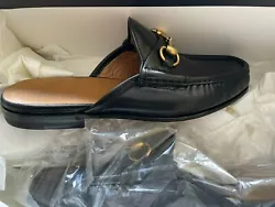 Black leather upper. Antique gold-tone Horsebit buckle - the one that made Gucci famous. Slip on loafer. Leather sole....