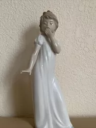 Nao by Lladro Yawning Girl 11 1/2” Tall. In good condition