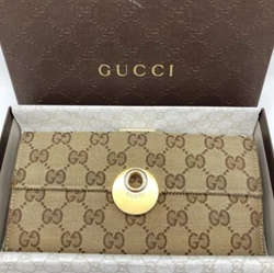 This is a gorgeous Gucci womens long wallet made of high-quality leather with a brown canvas and a supreme pattern. It...